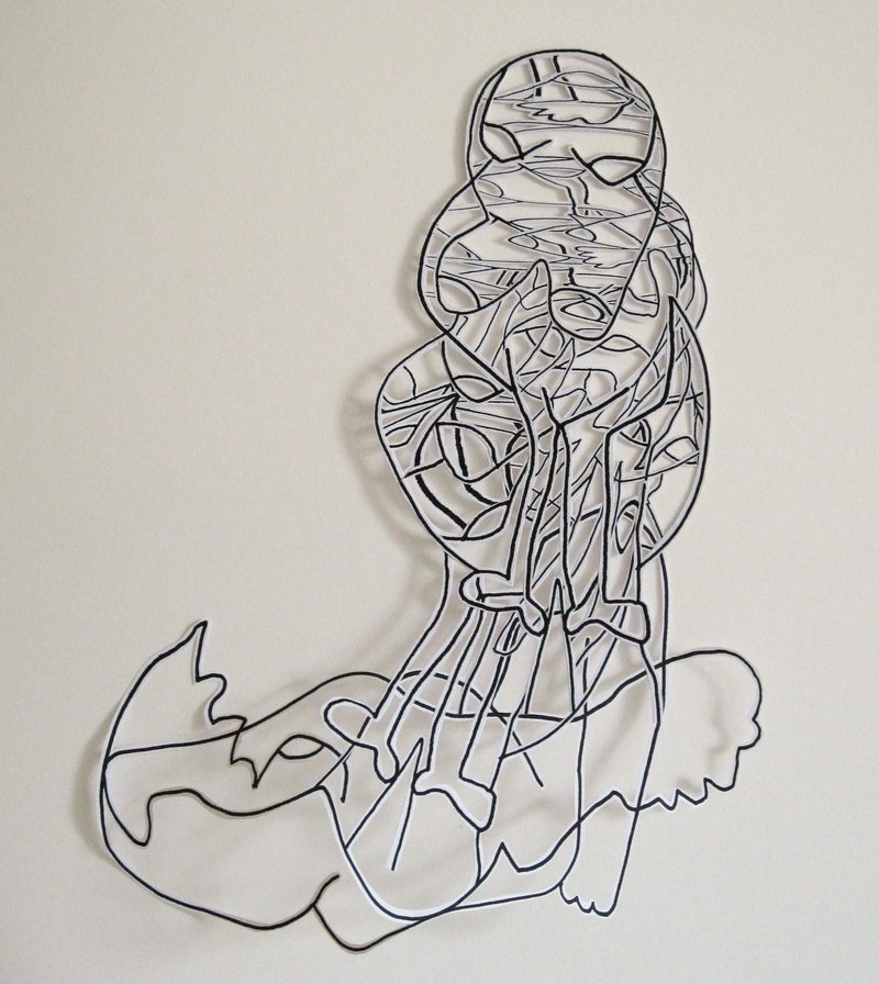paper collage of a fetus form